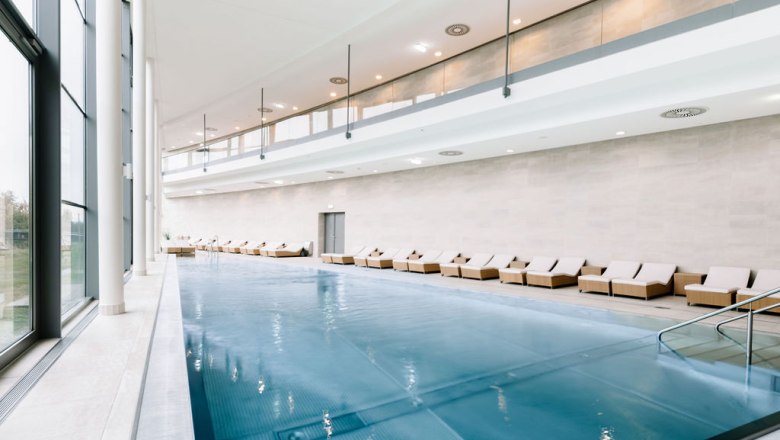 Laa thermal baths, © Victor Liska Interior view of a modern spa area with pool and loungers.